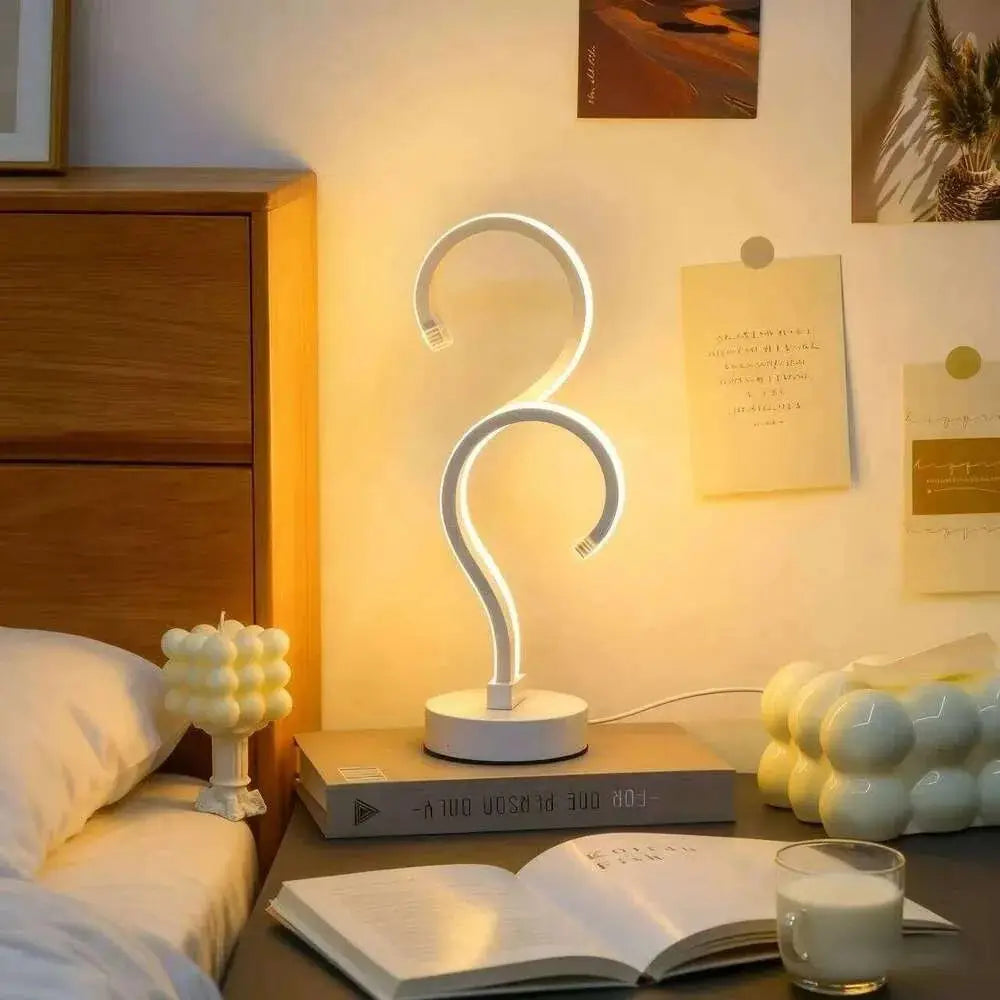 White led desk lamp with sleek curved design and modern minimalist aesthetic featuring 3 color modes