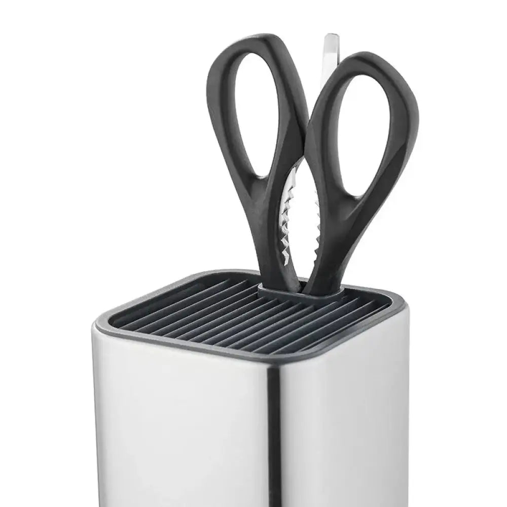Modern stainless steel universal knife and utensil holder with black-handled serrated kitchen scissors