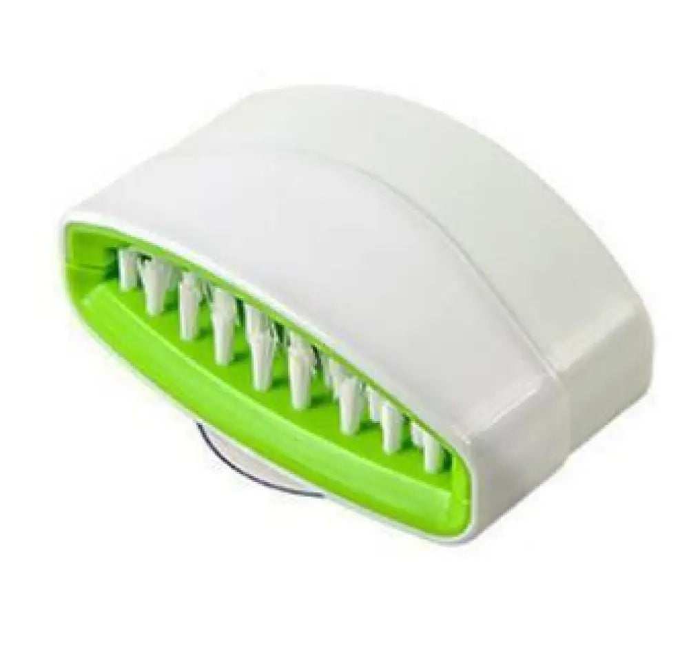 Multiuse suction cup kitchen brush and utensil scrubber in white and lime green plastic with ergonomic design