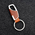 Premium leather and metal carabiner car keychain in brown leather with silver-toned metal clip for secure attachment