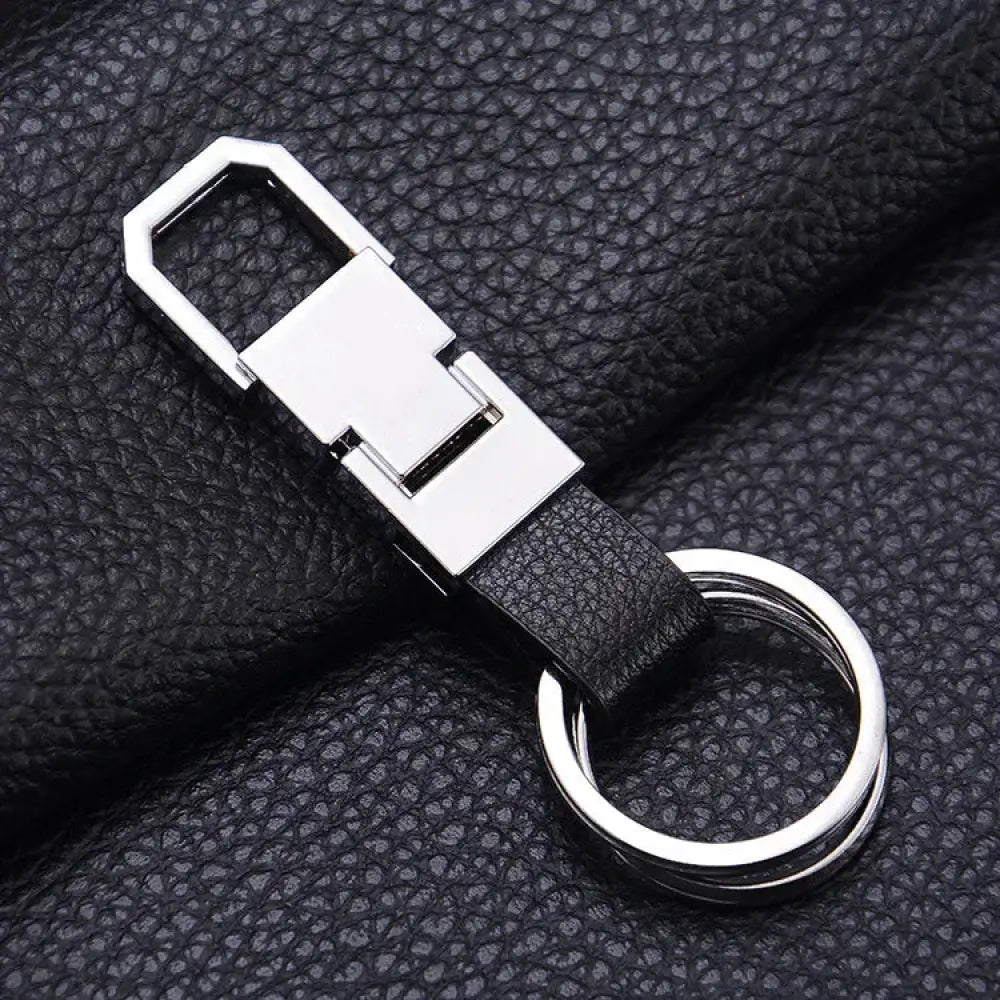 Black leather premium carabiner car keychain with silver metal clasp and double-ring attachment for secure holding