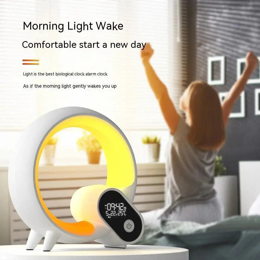 White and yellow crescent-shaped Q-light sunrise alarm clock with digital display showing time date and temperature