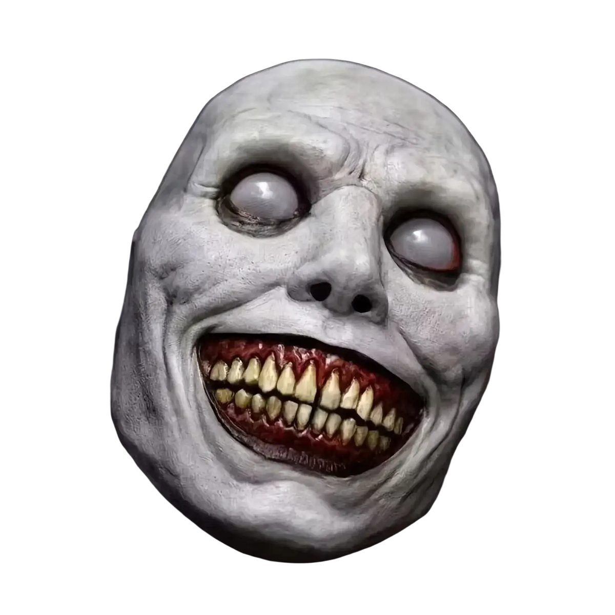 Creepy Halloween pale textured latex full face mask with wide hollow eyes and grotesquely smiling yellowed teeth