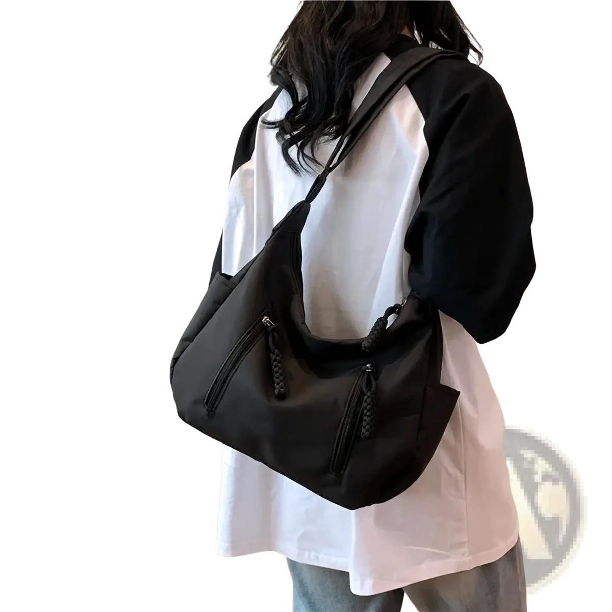 Black nylon crescent crossbody bag featuring braided zipper pulls and a lightweight shoulder strap tote design