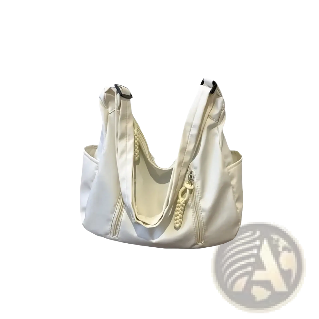 Cream-colored crescent nylon crossbody bag with braided zipper pulls and black-trimmed handles for lightweight use