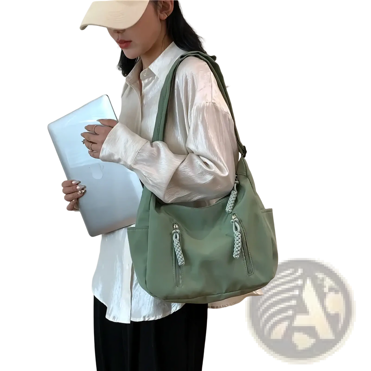 A sage green crescent nylon crossbody bag with braided zipper pulls and one adjustable shoulder strap