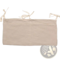 Beige linen crib storage bag diaper organizer showing tie-back with three tied fabric loops