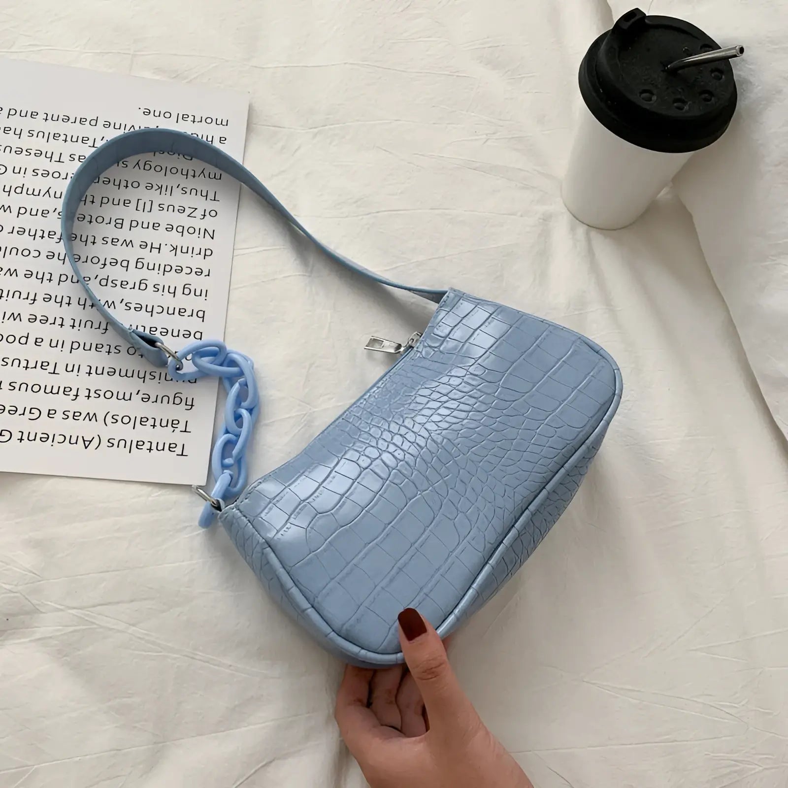 Light blue croc embossed chain shoulder bag for women featuring a matching croc embossed chain strap