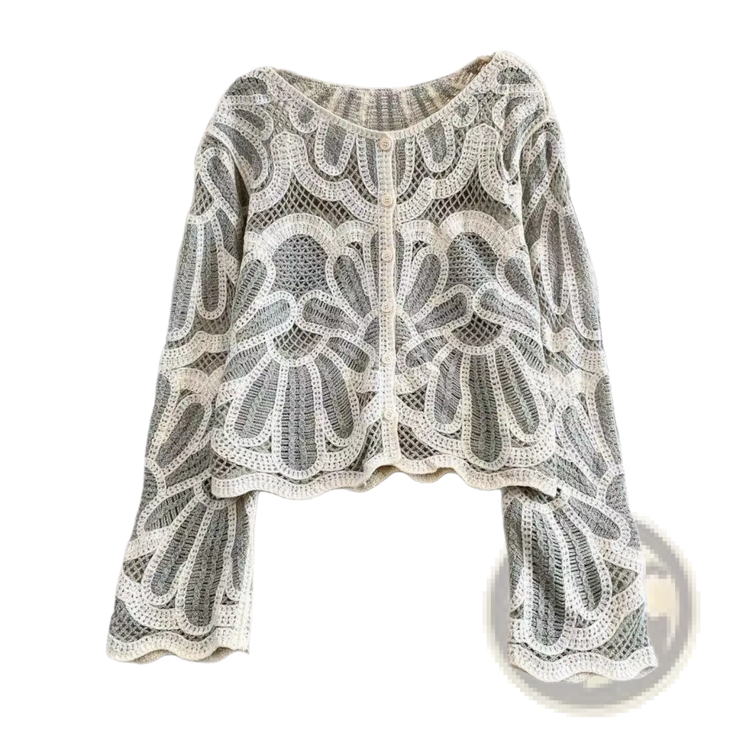 A delicate off-white crochet cardigan with intricate floral patterns and bell sleeves in a loose pullover style