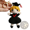 Crochet graduation doll keychain with blonde yarn hair black and white outfit red trim and black cap with red tassel