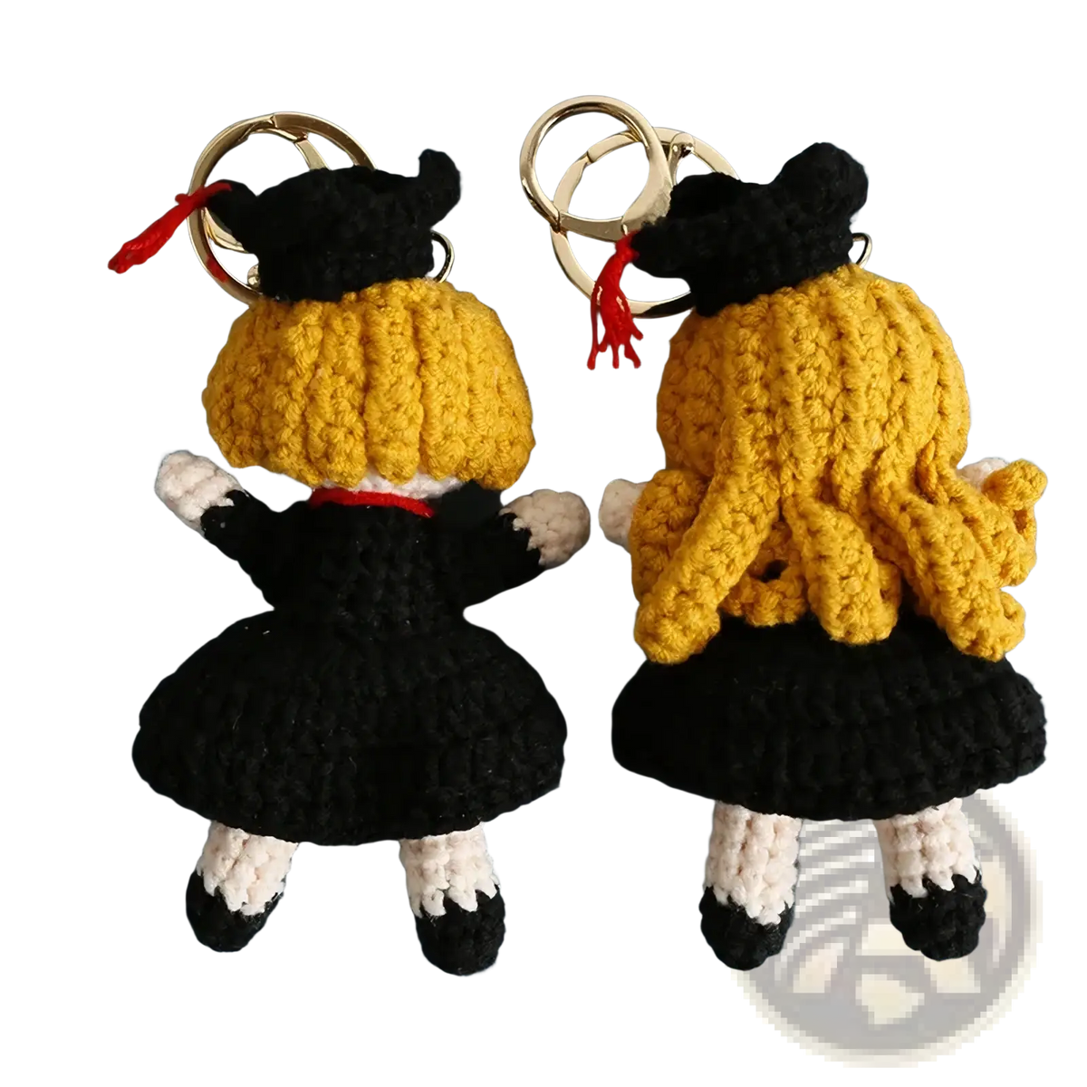 Crochet graduation doll keychains with golden yellow yarn hair black caps and gowns white socks and silver metal rings