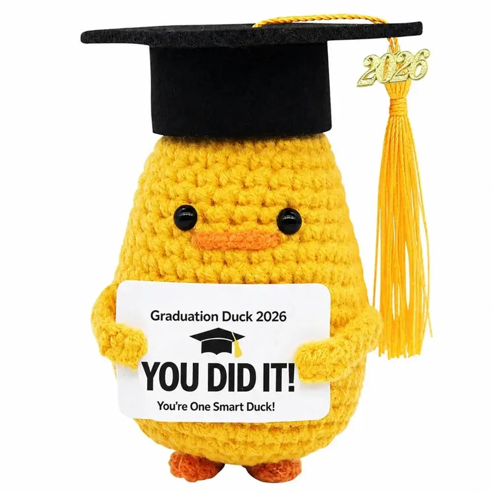 Yellow crocheted graduation puppy pocket hug keepsake wearing black cap with gold tassel holding you did it sign