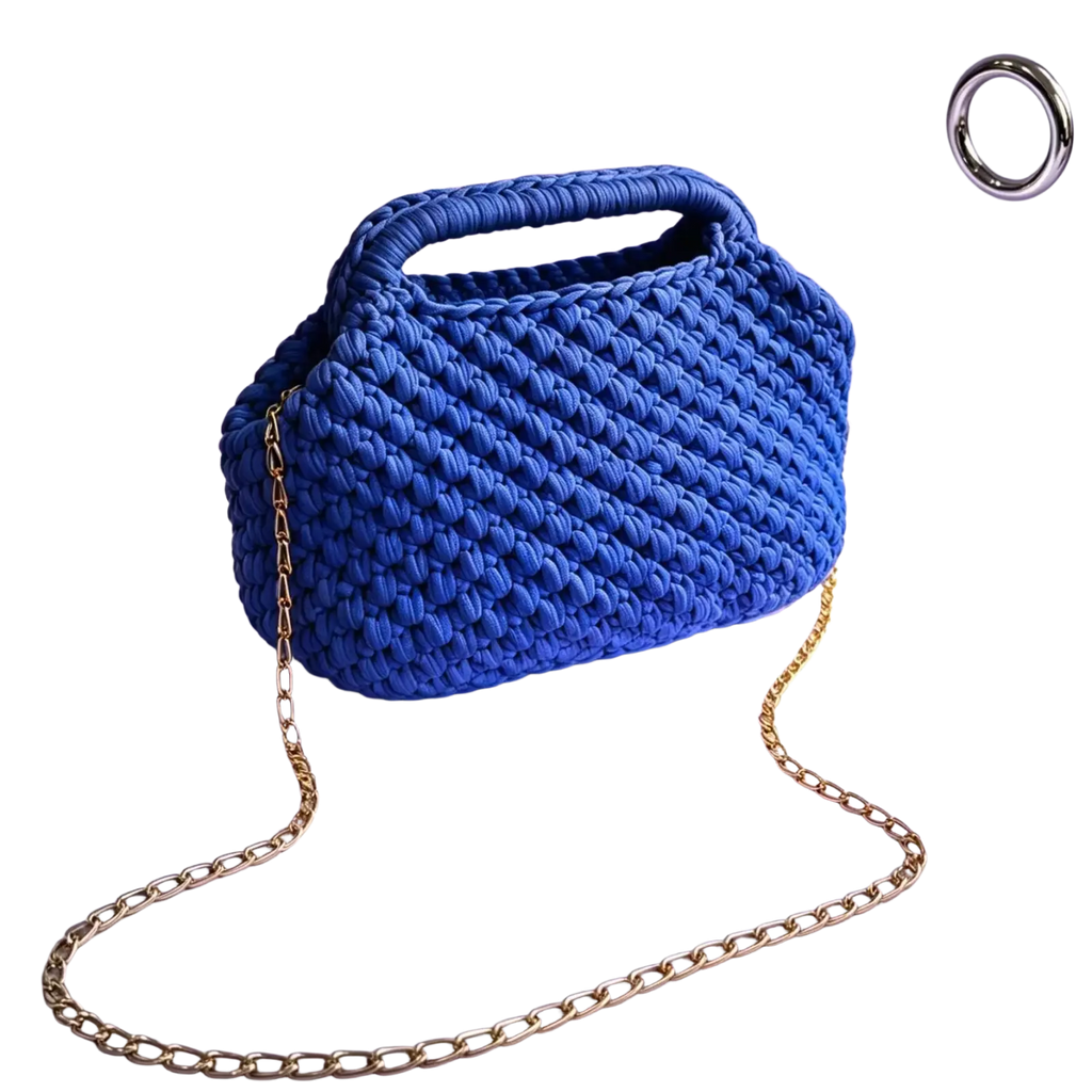 Vibrant cobalt blue crocheted shoulder bag with woven pattern and gold chain strap for beach vacation tote use