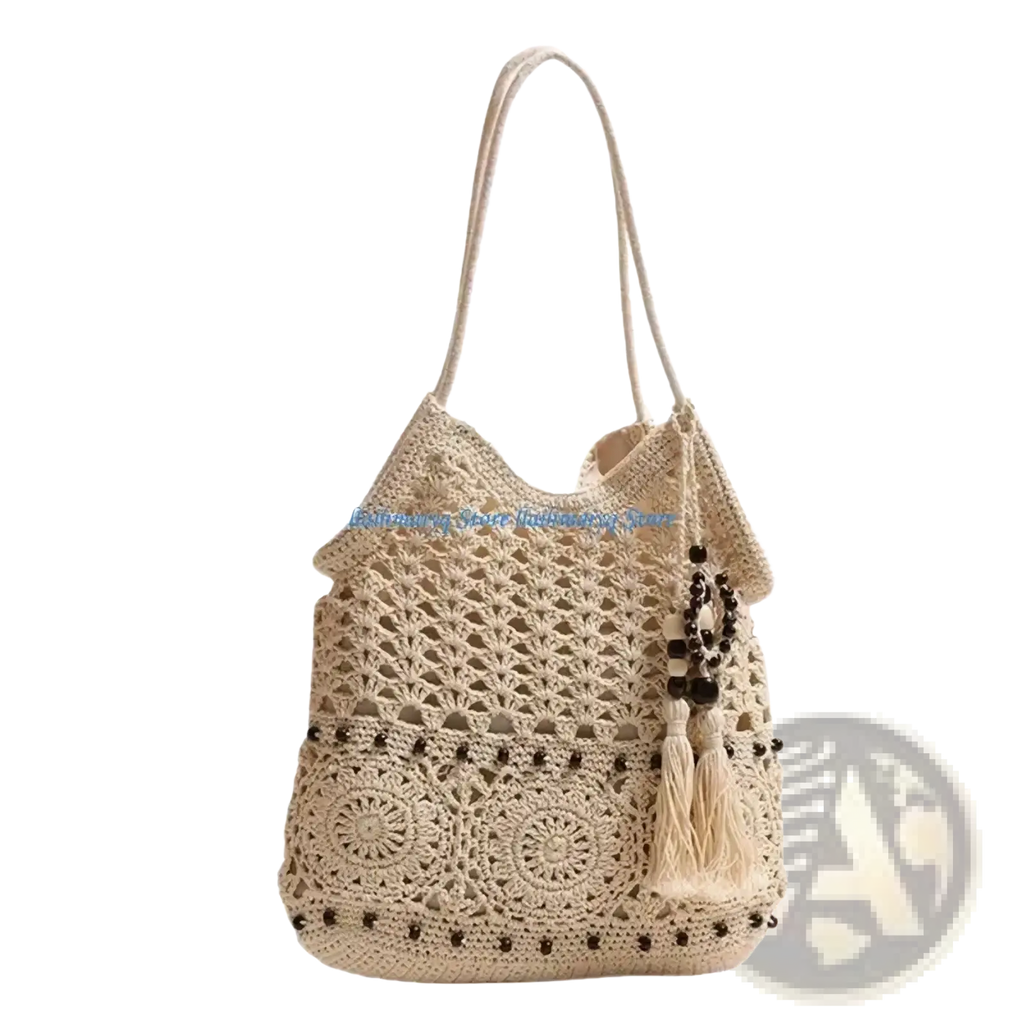Beige crocheted shoulder tote bag with intricate lace patterns dark brown bead accents and tassel detail for beach use