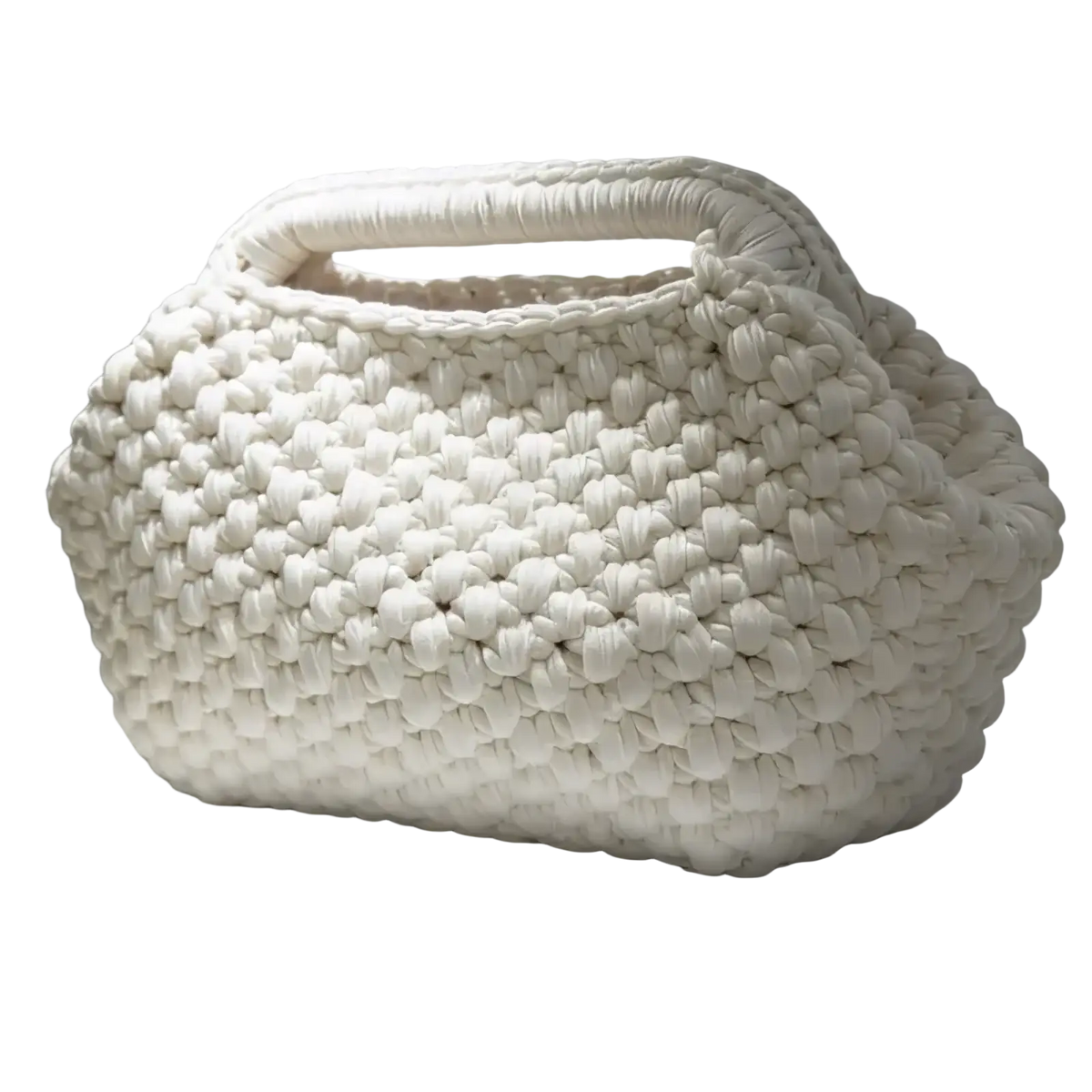 A chunky white crocheted shoulder bag with rounded puffy shape and integrated handle woven for beach use