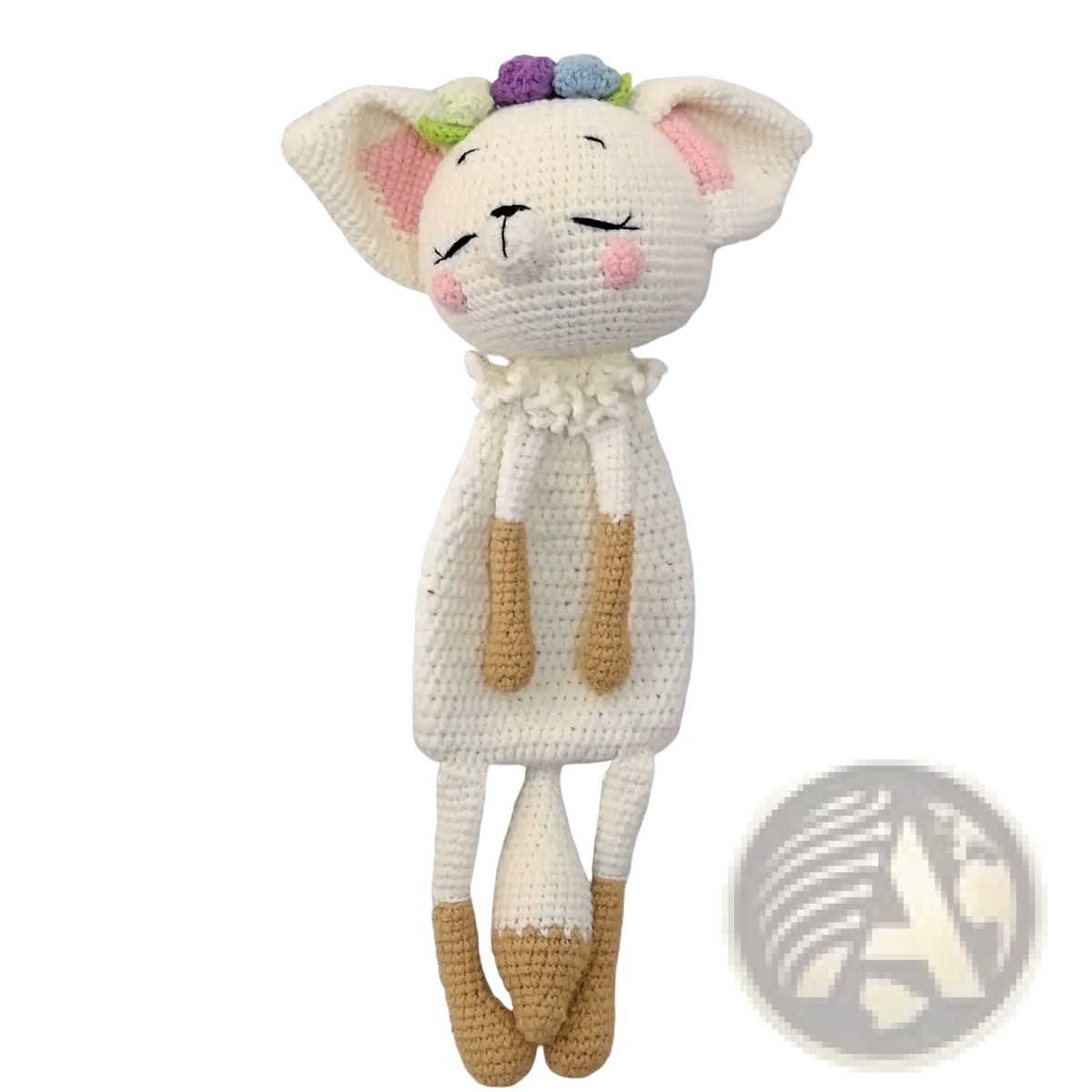 A soft white crocheted cat doll with pink ears and cheeks, tan paws, floral crown in crocheted unicorn baby comforter