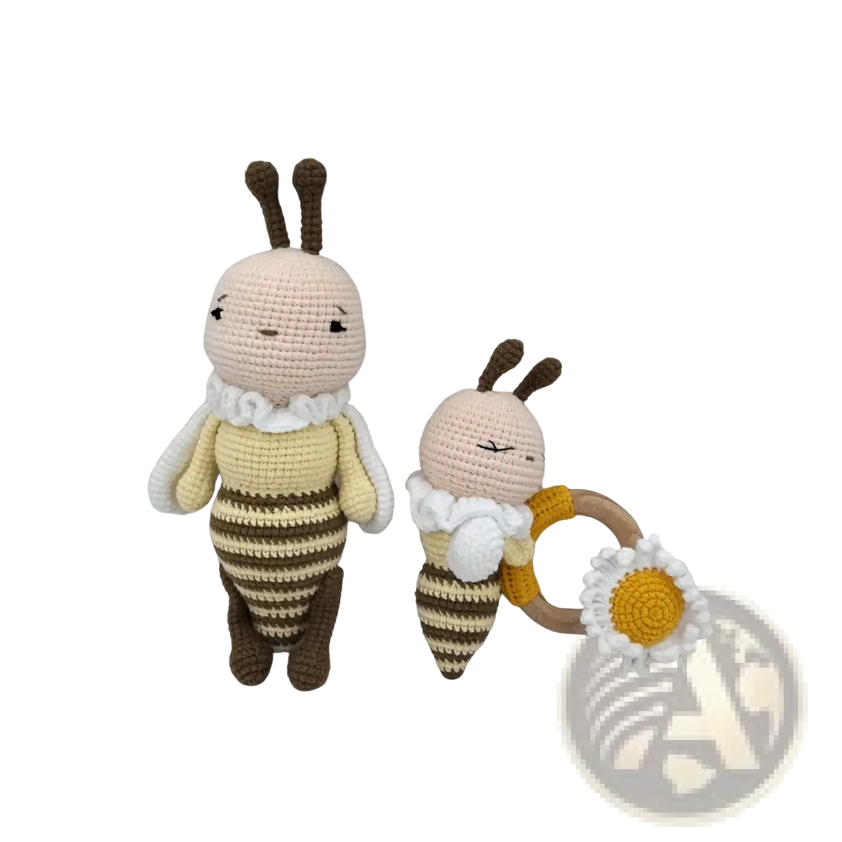 Two crocheted bee dolls in yellow and brown stripes with a ruffled collar and daisy ring as baby comforters