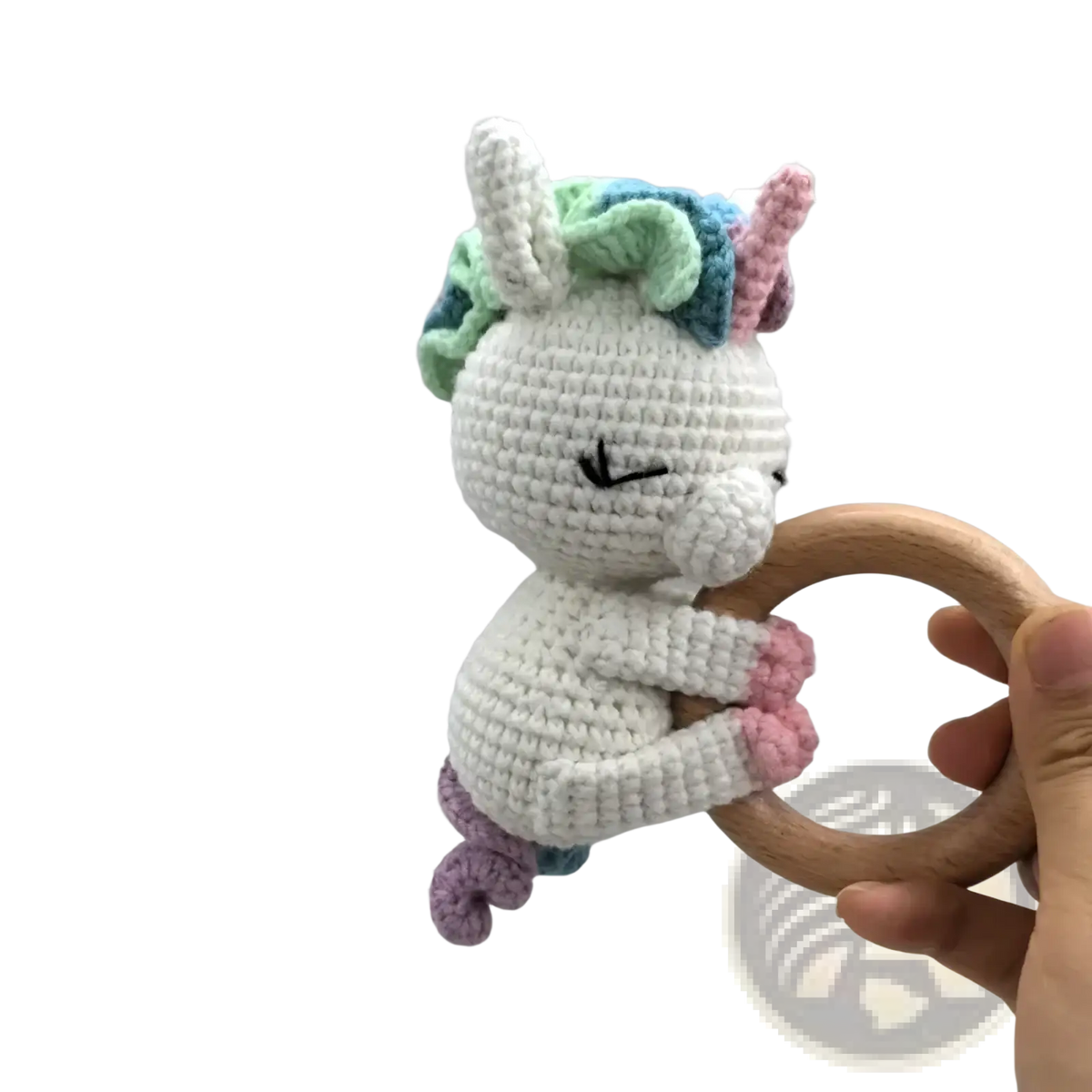Crocheted unicorn baby comforter security blanket with a white body pastel mane and tail and wooden ring handle