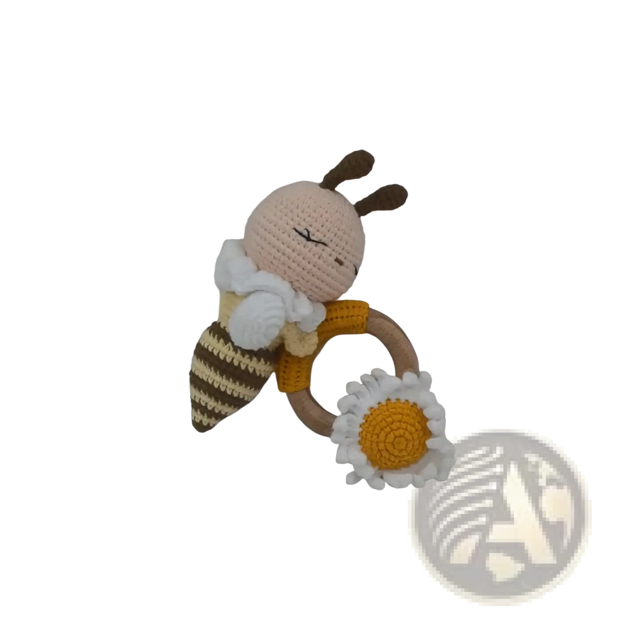 Crocheted unicorn baby comforter security blanket with a yellow bee rattle wooden ring and daisy attachment
