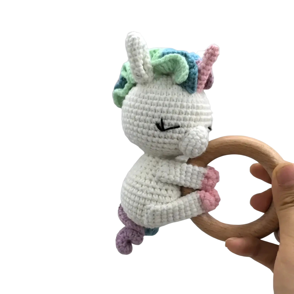 Crocheted unicorn baby comforter security blanket with a white body pastel mane and tail and wooden ring handle