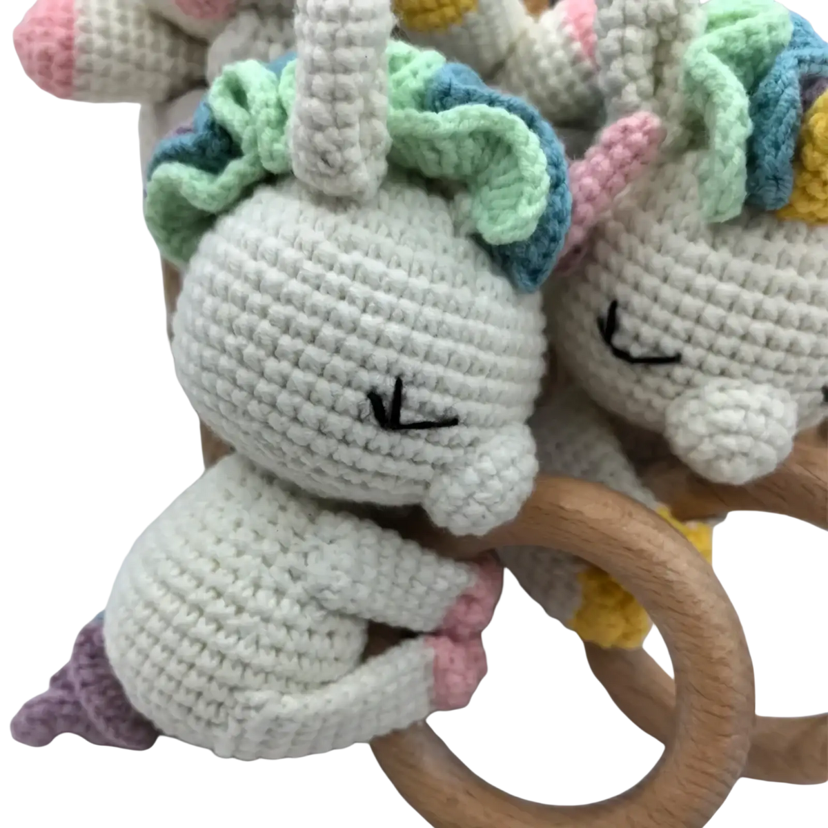 Crocheted unicorn baby comforter security blanket with soft white yarn pastel green and blue mane pink hooves wooden ring handle