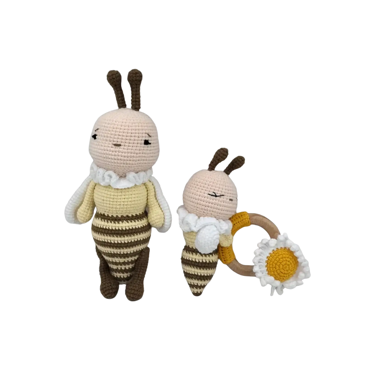 Two crocheted bee dolls in yellow and brown stripes with a ruffled collar and daisy ring as baby comforters