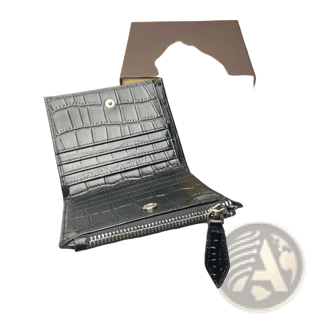 Black crocodile leather unisex wallet with silver-toned hardware and zipper pull in a sleek embossed design