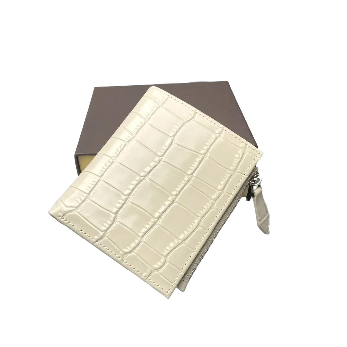 Cream-colored crocodile-embossed leather unisex wallet with zipper closure and matching pull tab