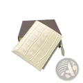 Cream-colored crocodile-embossed leather unisex wallet with zipper closure and matching pull tab