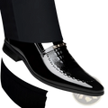 Black patent leather men’s loafer with glossy crocodile-embossed toe cap and gold-tone metal buckle detail