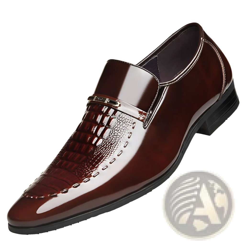 Polished burgundy crocodile patent leather men’s loafers with embossed toe and metallic buckle accent