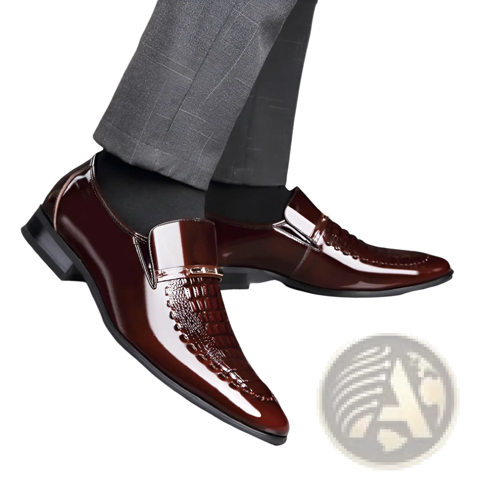 Polished burgundy crocodile patent leather men’s loafers with textured toe cap and metallic accent buckle