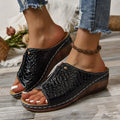Black croc-embossed platform wedge sandals for women featuring white stitching and gold-tone hardware