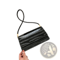 Black crocodile-embossed pu clutch bag with slender shoulder strap and gold-tone hardware for underarm use