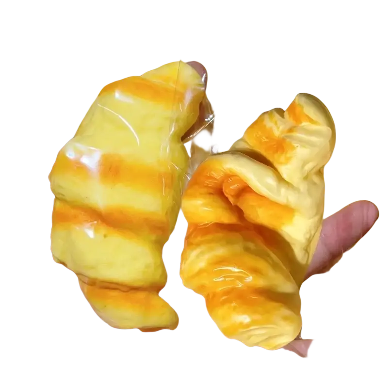 Yellow and orange striped croissant squeeze toy stress relief bread made of soft material for stress relief