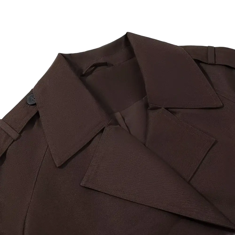 Cropped brown trench coat for women featuring a structured fabric collar with a single black button for casual outerwear