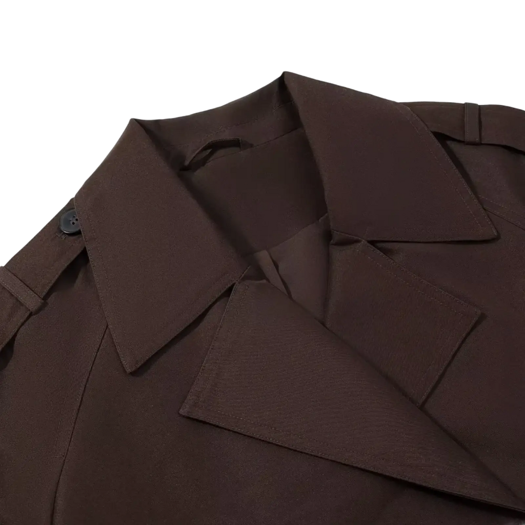 Cropped brown trench coat for women featuring a structured fabric collar with a single black button for casual outerwear