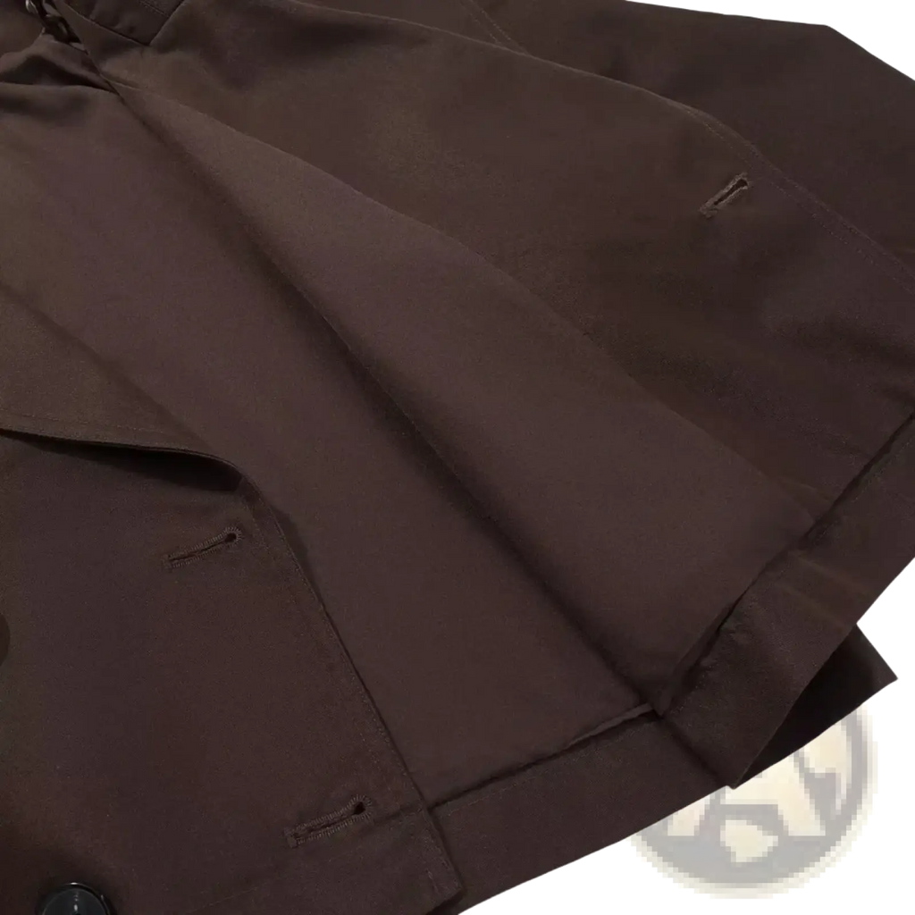 Dark brown cropped trench coat for women made of smooth structured fabric with subtle stitching details for casual wear