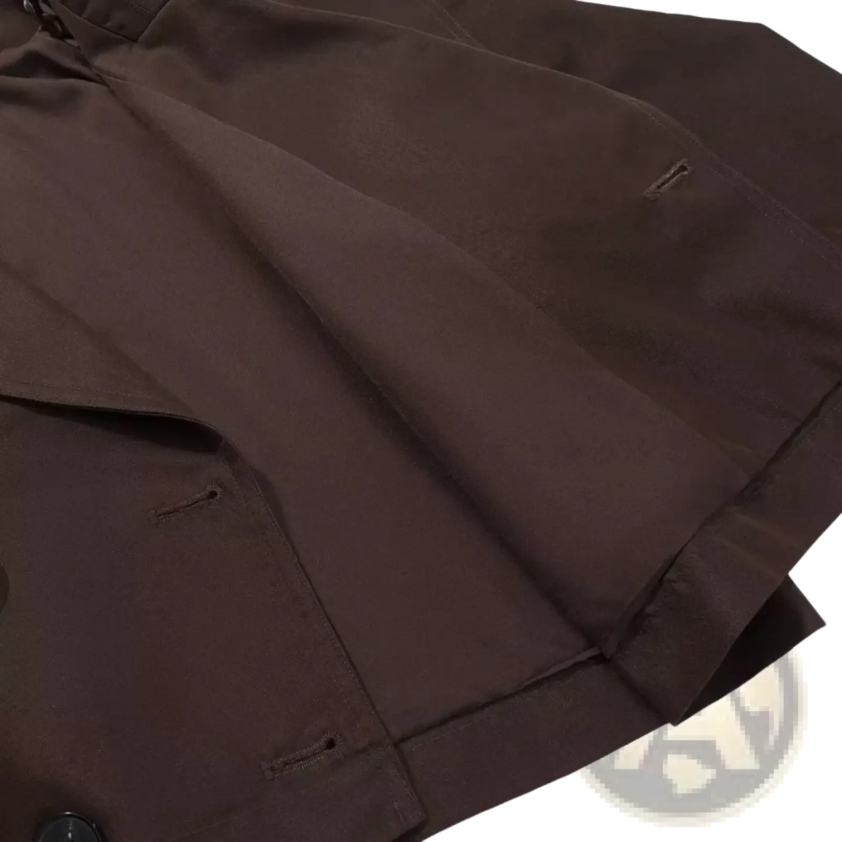 Dark brown cropped trench coat for women made of smooth structured fabric with subtle stitching details for casual wear