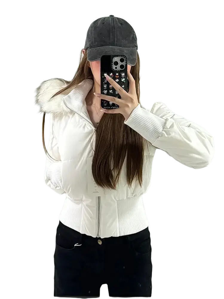 White cropped puffer jacket with fluffy fur-lined hood and ribbed cuffs for cold weather outerwear