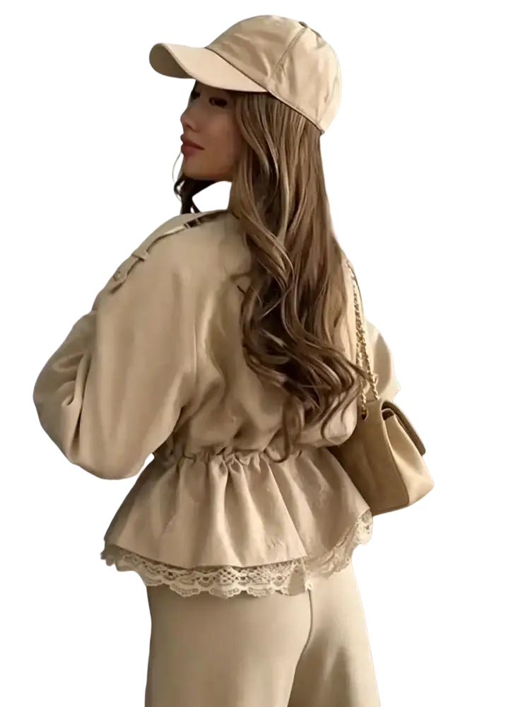 Beige baseball cap with soft textured fabric and subtle stitching details complements cropped lace hem trench jacket