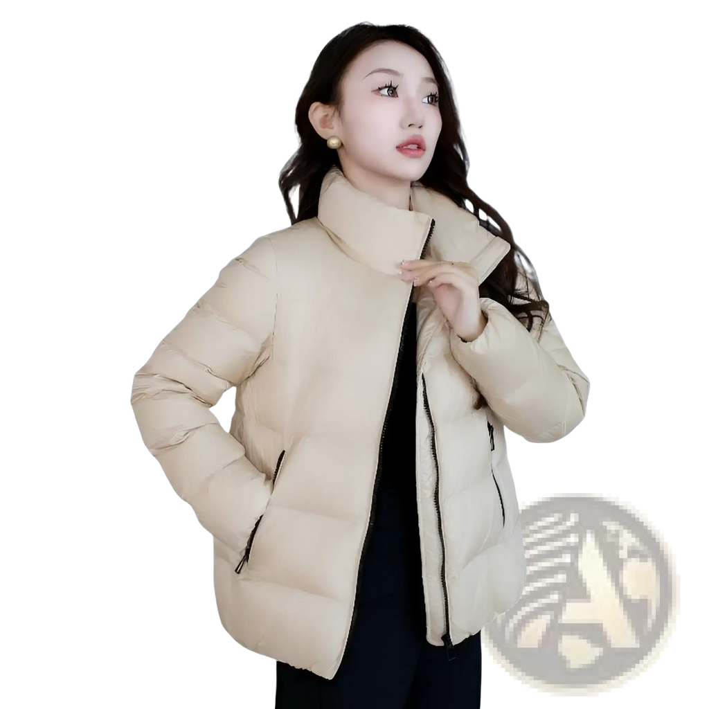 Beige cropped quilted down jacket for women with high collar and black zipper accents winter puffer style