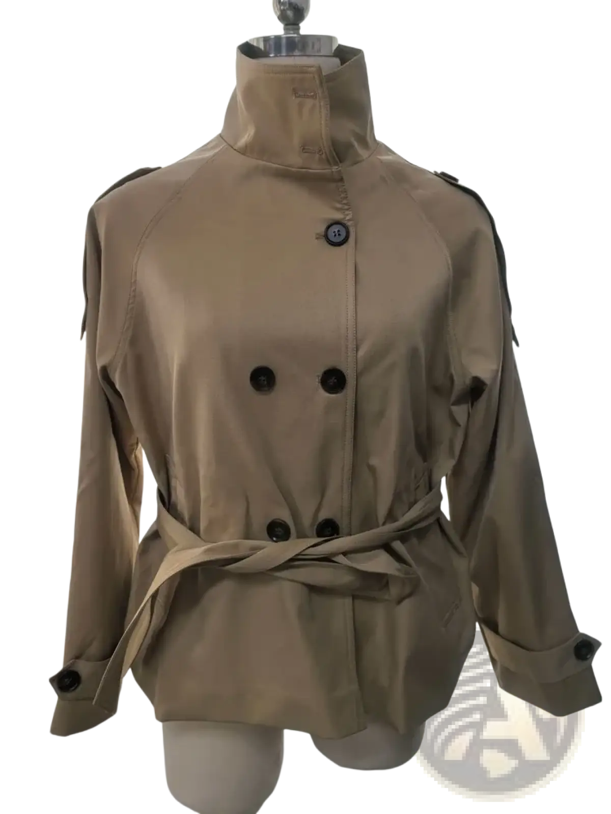Beige cropped trench jacket with black buttons and belted waist displayed on a mannequin for autumn outerwear