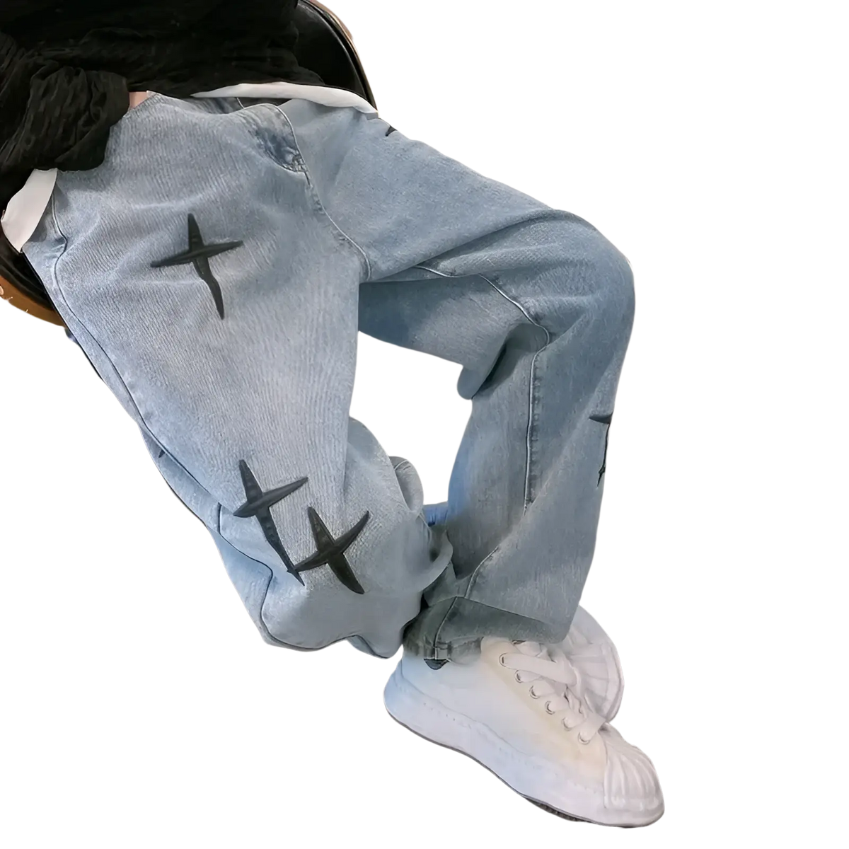 Light-wash denim baggy wide leg jeans with black cross embroidery on the thighs and knees