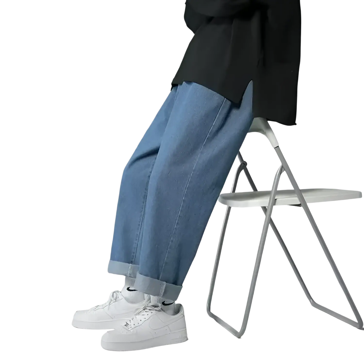 Light-wash blue denim cross embroidered baggy wide leg jeans with rolled cuffs made from durable denim fabric