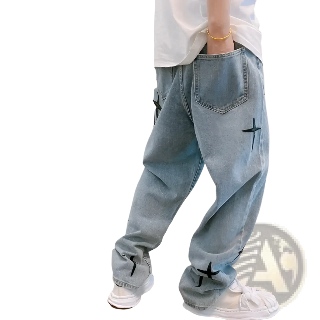 Light-wash denim wide leg cargo pants with black cross embroidery on thighs and cuffs