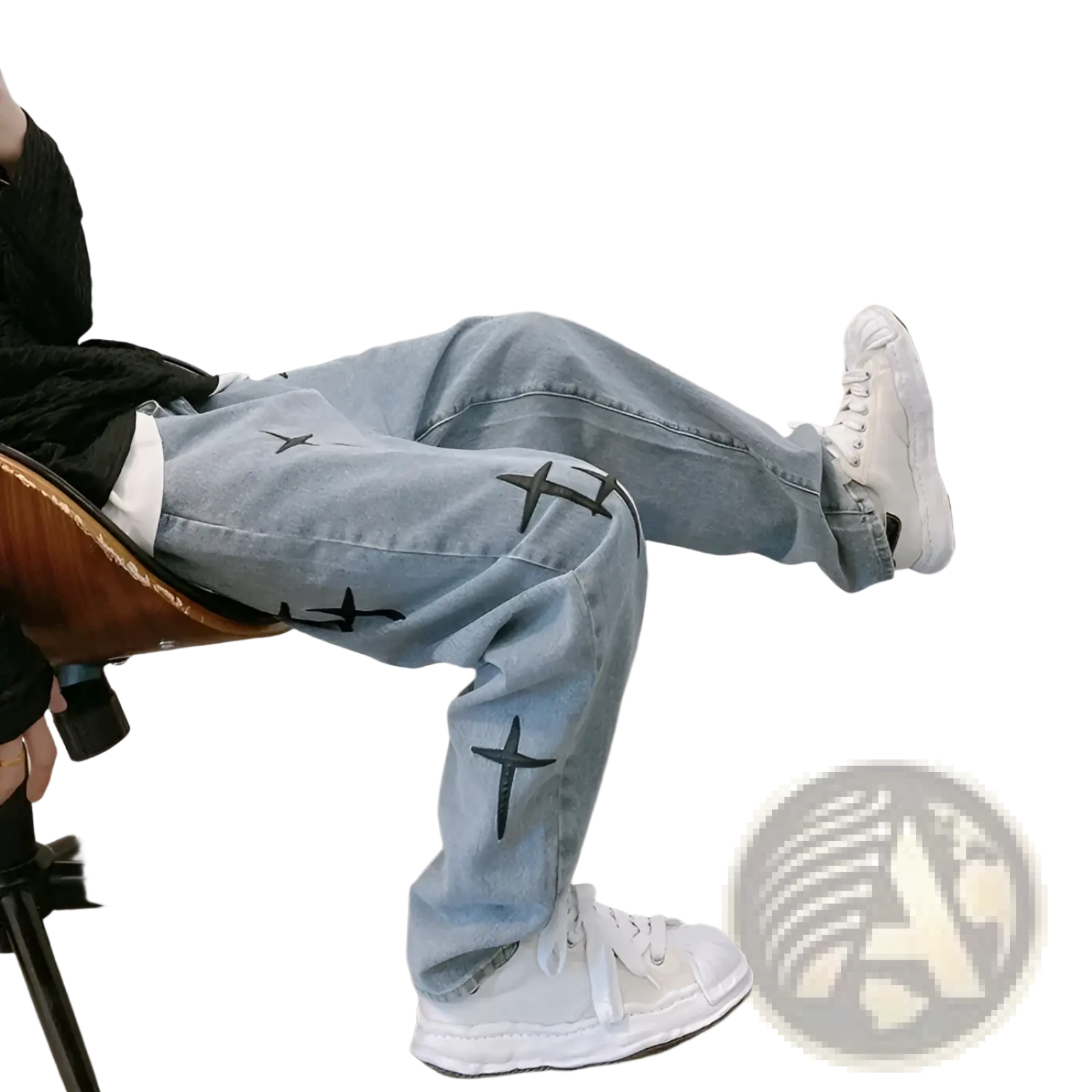 Light-wash denim cross embroidered wide leg cargo pants with black cross designs on the legs