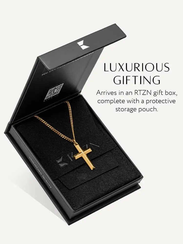 18k gold plated geometric cross pendant with curb chain in a gold tone displayed in an elegant black gift box