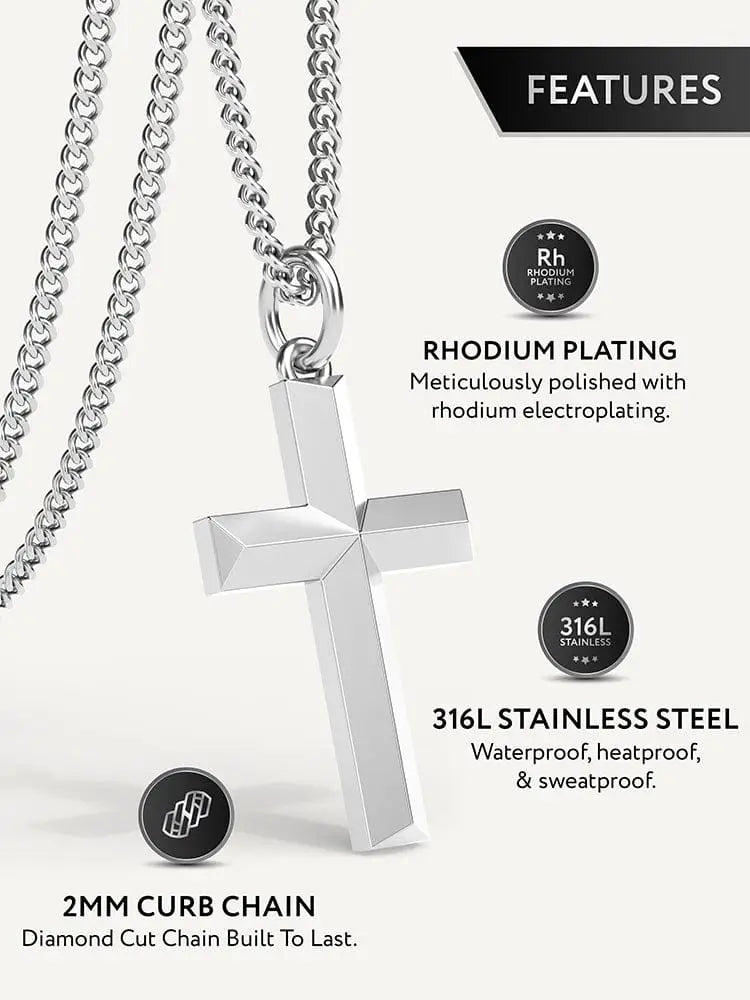 A geometric silver cross pendant with rhodium plating on a 316l stainless steel curb chain