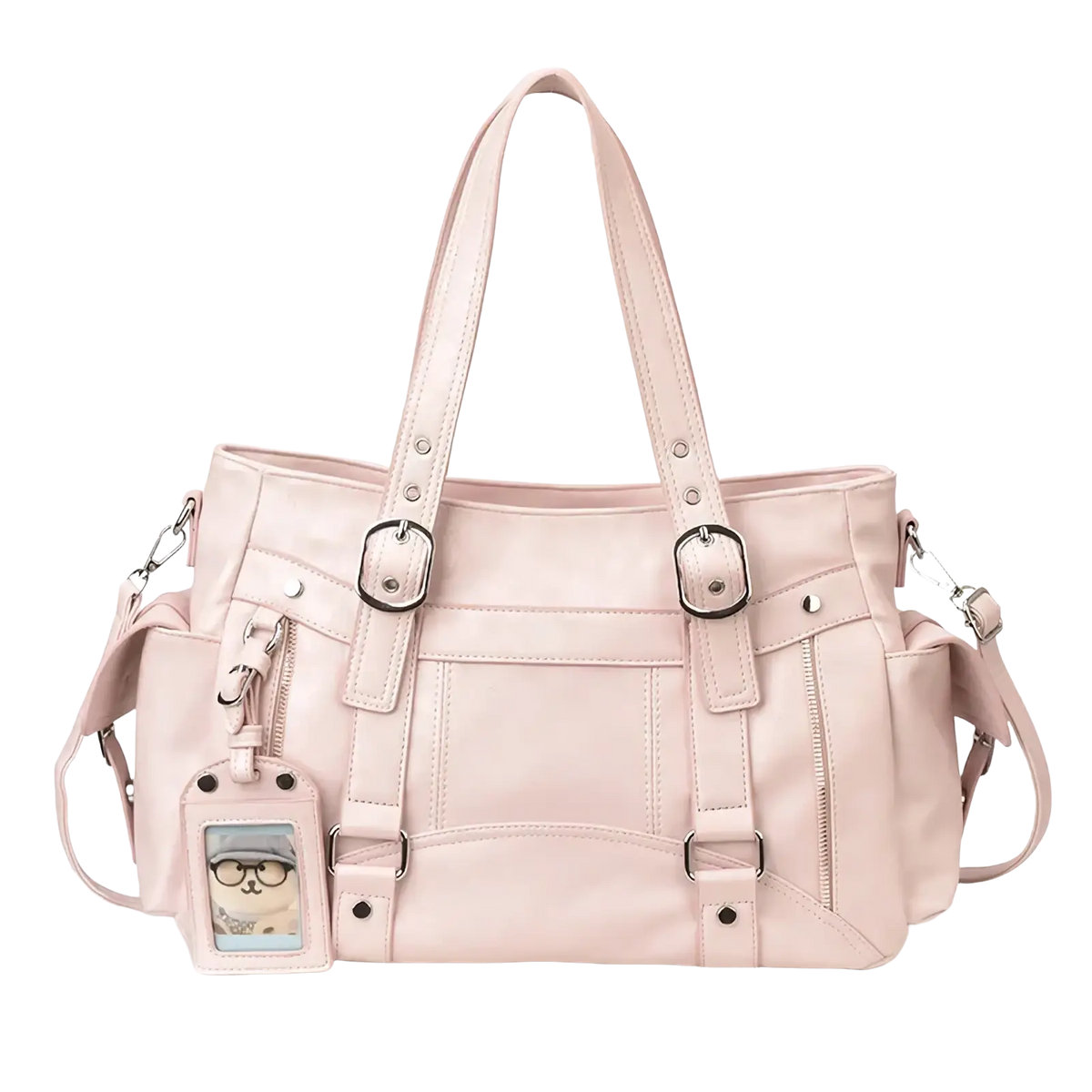 A blush pink faux leather large capacity tote bag with silver buckles and a cartoon cat id tag for commuting